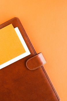 Modern workspace, productivity and corporate lifestyle concept - Luxury business brown brief-case on the office table desk, flatlay