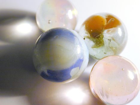 An assortement of childrens traditional toy glass and stone marbles