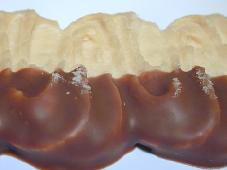 Close-Up of Chocolate Dipped Pastry Dessert on White Background