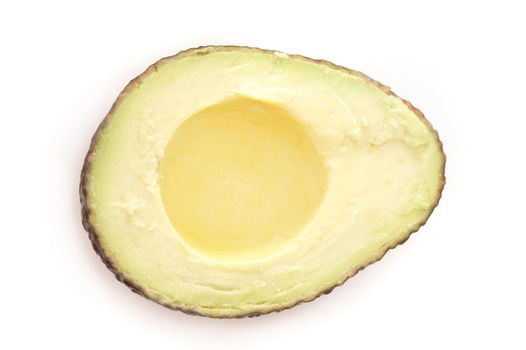 Fresh halved avocado pear on white showing the succulent soft flesh used as a salad ingredient and savory dip