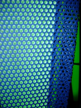 metal mesh with breen background illumination