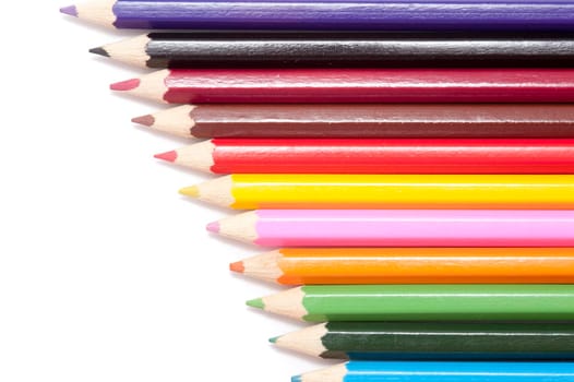 Close up shot of colorful pencils isolated on white background