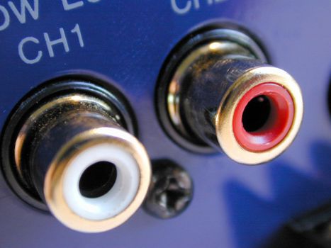 Detail image of RCA phono connections labeled with channel numbers on blue device back panel