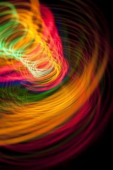 a dramatic background image of brightly coloured light