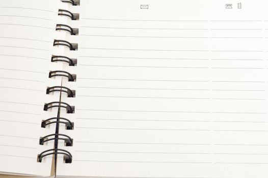 Open blank spiral bound notebook with lined pages ready for your text or message