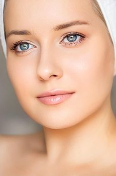 Skin care and beauty routine, beautiful woman with white towel wrapped around head, skincare cosmetics and face cosmetology, close-up portrait