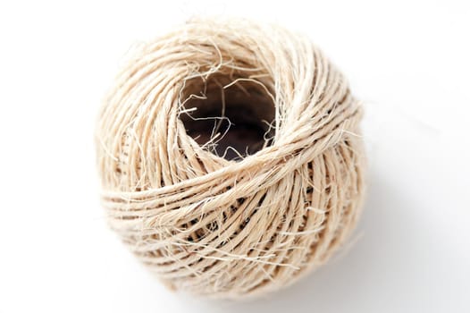 Close up Aerial Shot of Ball of Twine Isolated on White Background