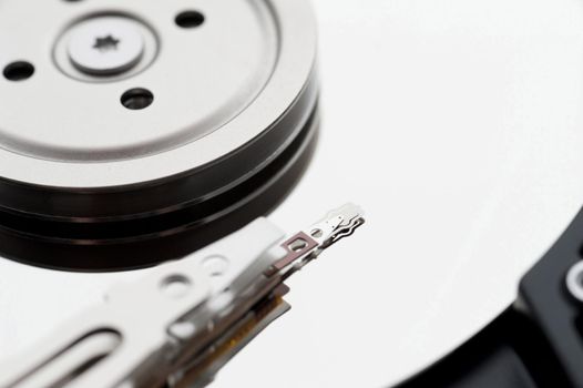 Abstract close up of a computer data storage hard drive and electrical components.