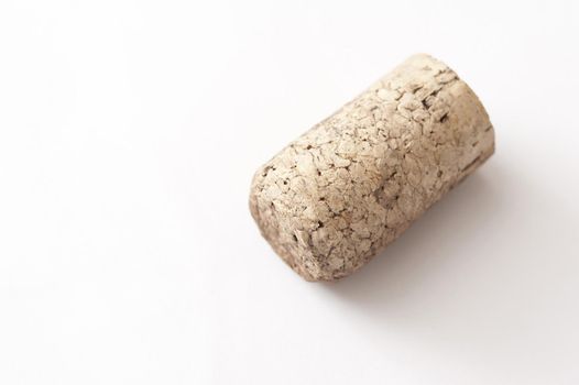 Clean dry old bottle cork on a white background with copyspace conceptual of a celebration and party