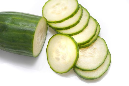 Freshly sliced cucumber for use as a salad ingredient in a health diet on a white background