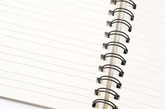 Open ringbound notepad with a blank lined page for your text or message