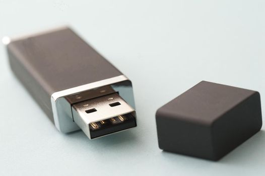 Open portable computer memory flash drive with focus to the universal USB connection or plug