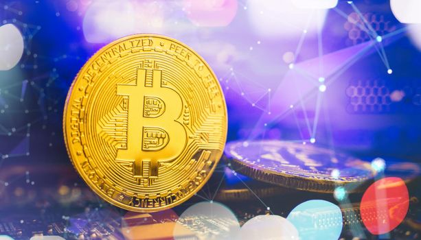 Bitcoin cryptocurrency new version on computer electronic circuit board background . Virtual cryptocurrency money Bitcoin golden