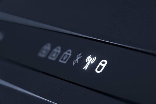 indicator lights on a laptop, hard disk access and wireless network service