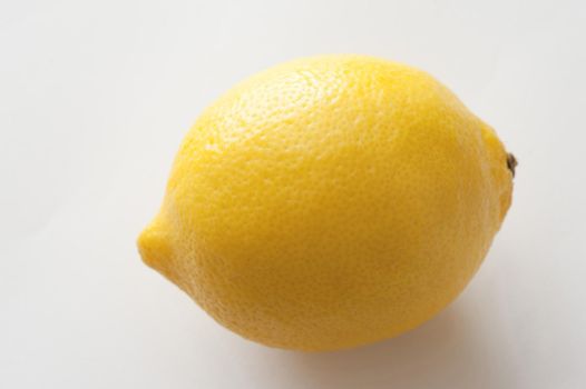 Close-up of yellow lemon on white background. Isolated