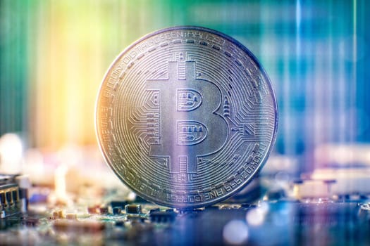 Cryptocurrency concept , Golden bitcoin on mainboard , The future of money. Computational equipment.