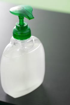 Close up on an unlabelled bottle of hand sanitizer with pump action in a concept of personal hygiene and and washing during the Covid-19 pandemic