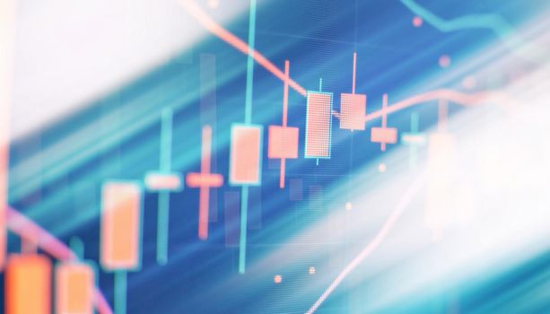 Analysis business accounting on info sheets. Businessman hand working on analyzing investment charts for Gold market, Forex market and Trading market.