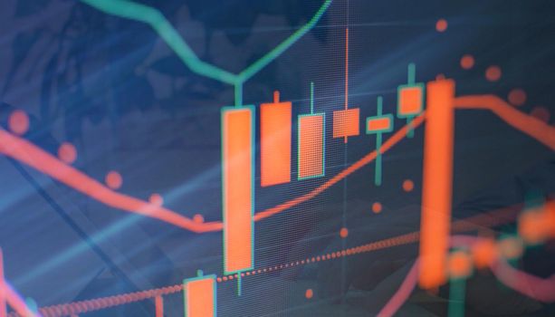 Analysis business accounting on info sheets. Businessman hand working on analyzing investment charts for Gold market, Forex market and Trading market.