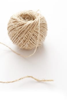 Close up Ball of off White String Isolated on White Background, Emphasizing Copy Space.