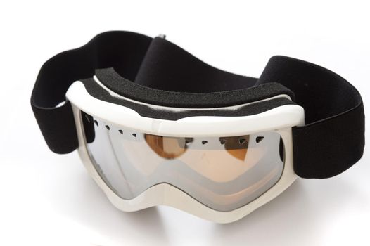 Pair of tinted winter goggles for skiing or snowboarding to protect the eyes from injury and the reflection off the snow