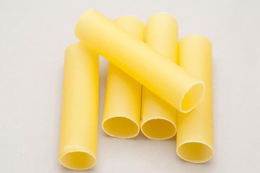 Dried Italian cannelloni pasta tubes made from durum wheat dough for a healthy Mediterranean and vegetarian diet