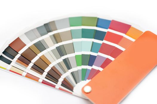 Opened color chart for interior decorating or typography displayed fanned on a white background in a DIY and renovation concept