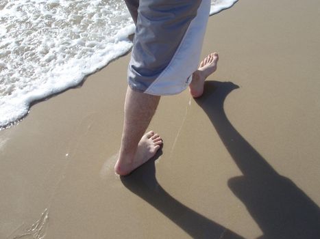 a leisurely walk along a sandy beach in summer