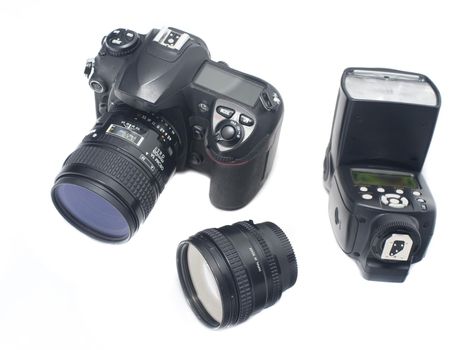 Isolated digital camera, wide angle lens and adjustable flash strobe over white background