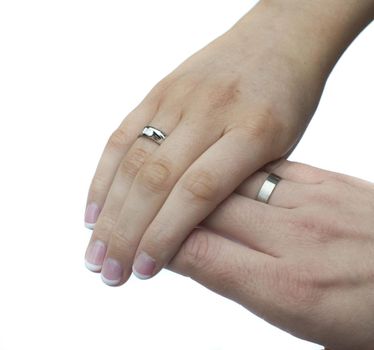 close up on the hands of a young couple holding each others hands