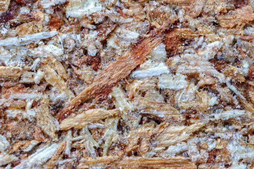 Macro of pressed wooden panel background, the texture of oriented strand board - OSB wood.