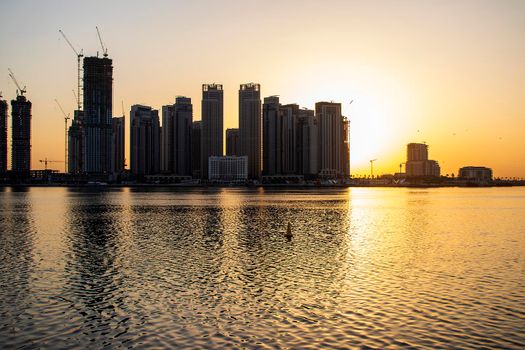 Sunrise in Jadaf area of Dubai, view of Dubai creek Harbor construction of which is partially completed. Outdoors