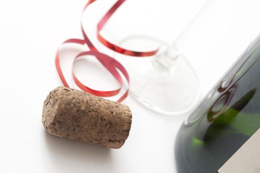 Champagne Cork and party ribbons with the stem of a glass in view