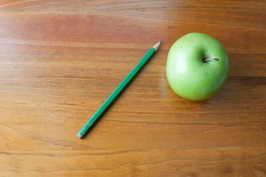 education background, an apple on a wooden school desk