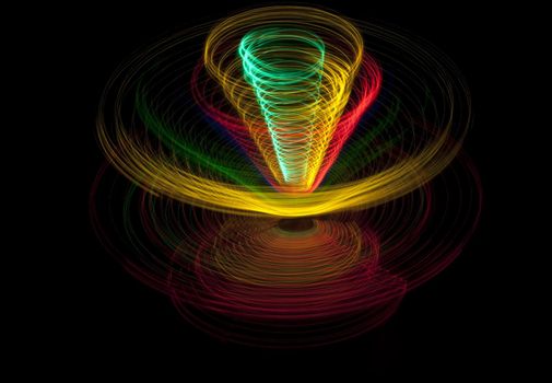 abstract pattern of coloured elipises stacked to form a conical pattern