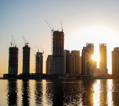 Sunrise in Jadaf area of Dubai, view of Dubai creek Harbor construction of which is partially completed. Outdoors