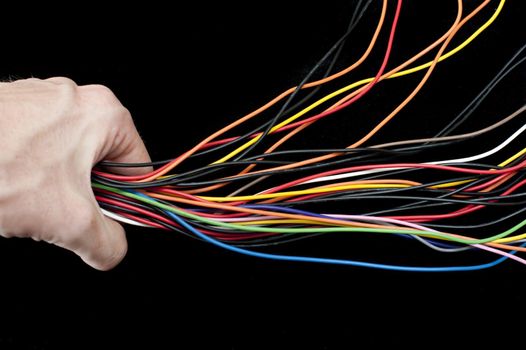 Streamlining multiple divergent coloured electrical wires by condensing them down into a single stream passing through a human hand