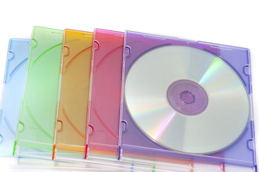 Close up Pile of Colorful Compact Disc Cases Isolated on White Background