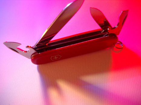 detail of the blades of a red swiss army knife
