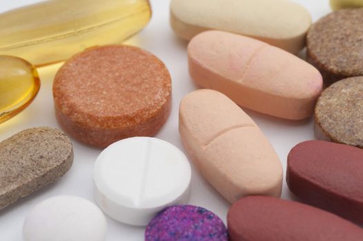an assortment of multivitimin and supplement tablets