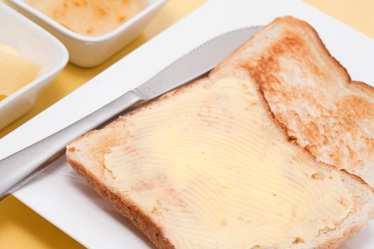 buttered white toast on a plate