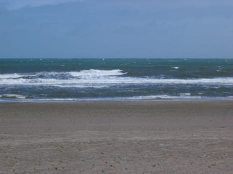 waves lapping on a sandy shoreline