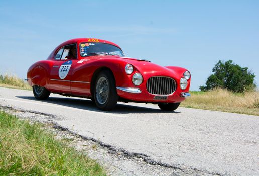 URBINO - ITALY - JUN 16 - 2022 : FIAT 8V BERLINETTA 1952 on an old racing car in rally Mille Miglia 2022 the famous italian historical race (1927-1957