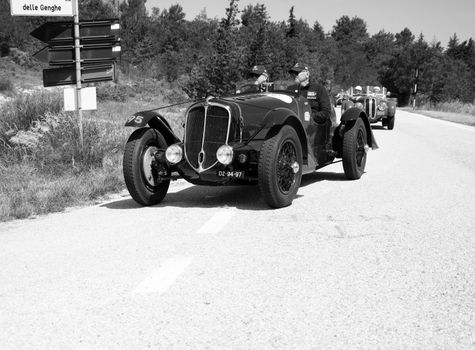 URBINO - ITALY - JUN 16 - 2022 : DELAHAYE 135 CS 1936 on an old racing car in rally Mille Miglia 2022 the famous italian historical race (1927-1957