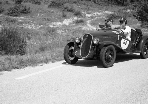 URBINO - ITALY - JUN 16 - 2022 : FIAT 508 S BALILLA COPPA D ORO 1934 on an old racing car in rally Mille Miglia 2022 the famous italian historical race (1927-1957