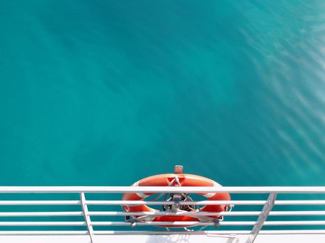 a life ring on the side of a boat, symbolic of safety and security   