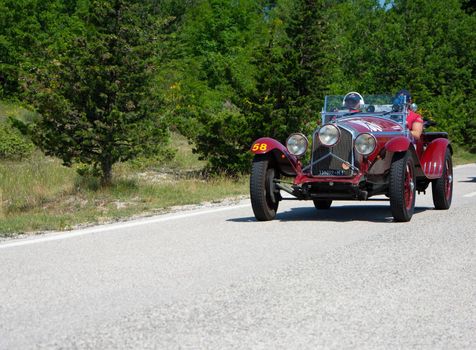 URBINO - ITALY - JUN 16 - 2022 : ALFA ROMEO 6C 1500 SUPER SPORT 1929 on an old racing car in rally Mille Miglia 2022 the famous italian historical race (1927-1957