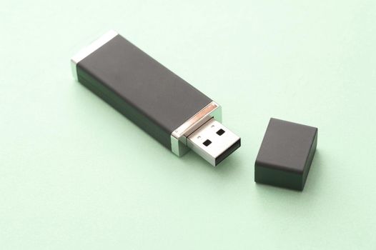 Open USB flash storage drive for a computer on a green background with copy space in a communications concept