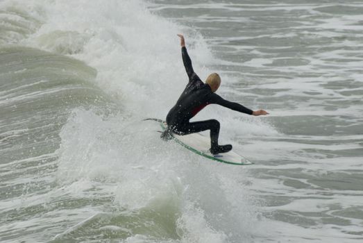 a surfers in the cold pacific waters off the californian coast