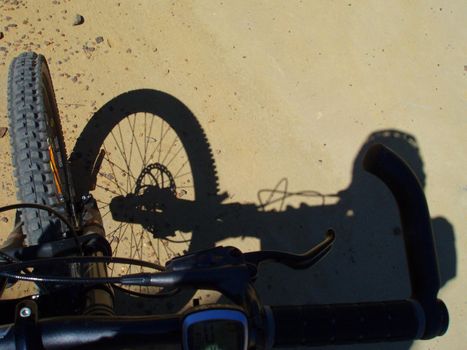 a riders eye view of a bike ride along a dirt trail
